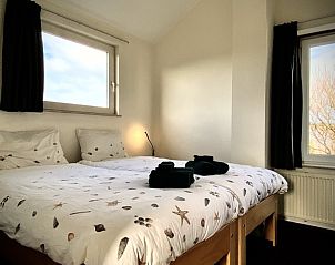 Bright bedroom in Stappeland - Huize 100-1, vacation home in De Koog, Texel, with beautiful view and comfortable bed.
