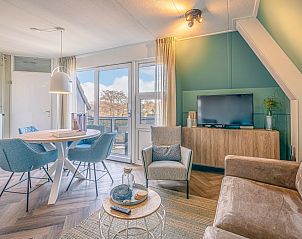 Cozy living room in Apartment Zeedistel 22, De Koog, Texel with modern interior and lots of light.