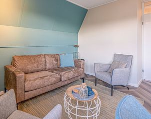 Spacious living room in Apartment Zeedistel 22, De Koog, Texel with modern furniture and cozy decor.