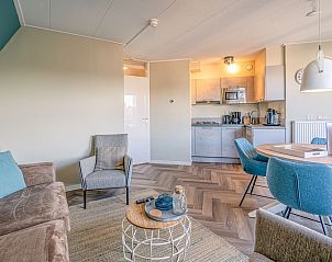 Open kitchen and dining area in Apartment Zeedistel 22, De Koog, Texel with complete amenities.