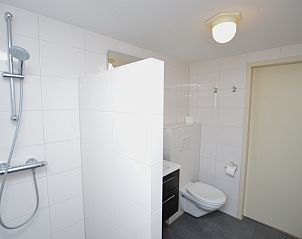 Spacious bathroom in Holiday home Stappeland 213, De Koog, Texel with walk-in shower and contemporary design.