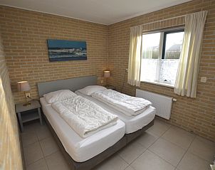 Comfortable bedroom in Holiday home Stappeland 213, De Koog, Texel with double bed and natural light.
