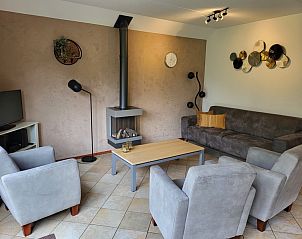 Cozy living room of Agter Mienterglop - Holiday home 5102 in De Koog Texel with fireplace.