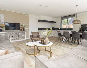 Modern open kitchen and dining area in Villa 21A, De Koog, Texel, ideal vacation home on the Wadden Islands.