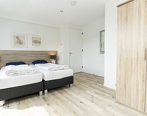 Large bedroom with double bed in Villa 21A, De Koog, Texel, vacation home on the Wadden Islands.
