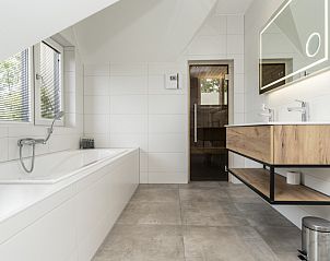Spa-like bathroom with bathtub in Villa 21A, De Koog, Texel, vacation home on the Wadden Islands.
