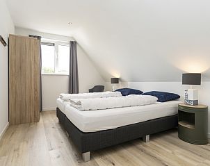 Attractive bedroom under the roof in Villa 21A, De Koog, Texel, vacation home on the Wadden Islands.