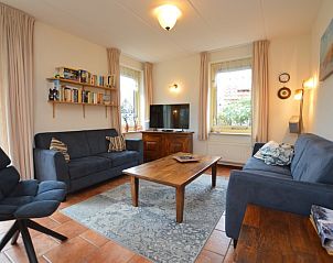 Bright living room in Holiday home 7K, De Koog, Texel with spacious seating area and television for relaxation on the Wadden Islands.