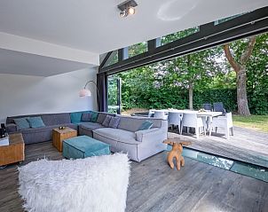 Stylish living room in Park Duynzoom - Villa Duynzoom, Texel, overlooking garden and terrace.