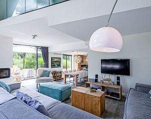 Cozy living space in Park Duynzoom - Villa Duynzoom, Texel, with open kitchen and spacious sitting area.