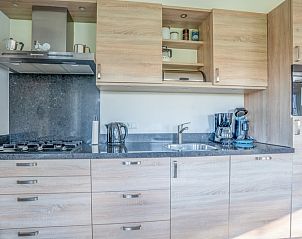 Modern kitchen in Maaikeduinweg 13 vacation home, De Koog, Texel equipped with all conveniences for a comfortable stay.