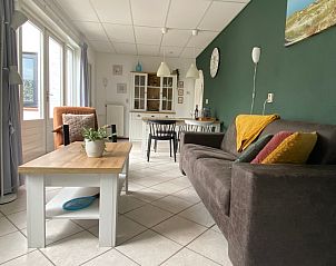 Cozy living room in vacation home Riddertje, De Koog, Texel. Comfortable seating area for relaxation.