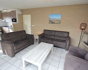 Spacious open kitchen and sitting area in Holiday home Stappeland 207, De Koog, Texel, perfect for family gatherings.