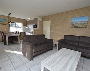 Modern dcor in the living room of Holiday home Stappeland 207, De Koog, Texel with access to the kitchen.