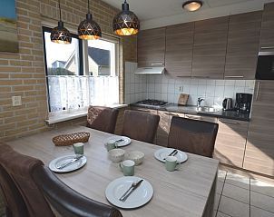 Fully equipped kitchen in Holiday home Stappeland 207, De Koog, Texel with modern amenities and dining area.
