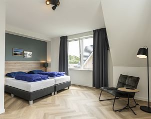 Spacious bedroom with view in Villa 39, De Koog, Texel. Comfortable vacation home on the Wadden Islands.
