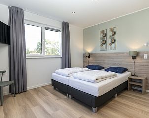 Bedroom in Villa 37a, De Koog, Texel, vacation home with double bed and quiet atmosphere for a relaxing stay.