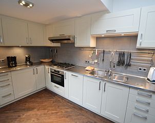 Stylish kitchen of Orchismient 28 De Koog Texel with spacious layout.