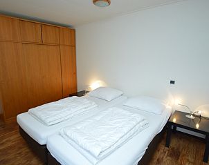 Bedroom in vacation home Orchismient 28 De Koog Texel with double bed.