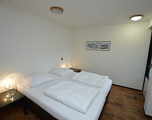 Cozy bedroom in Orchismient 28 De Koog Texel with relaxing atmosphere.