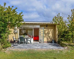 Cozy terrace of Bungalow 51 in Bungalowpark 't Luwe Land, De Koog, Texel, with garden furniture.