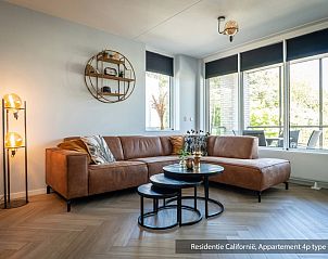 Spacious sitting area in Type 1 vacation home, De Koog, Texel with modern furnishings and views of nature.