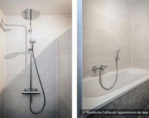 Modern bathroom in Type 1 vacation home, De Koog, Texel with shower and bathtub.