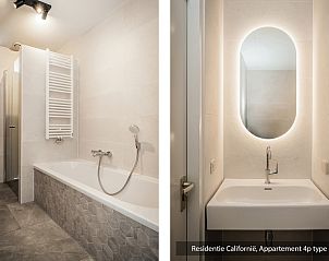 Stylish bathroom in Type 1 vacation home, De Koog, Texel with sink and mood lighting.