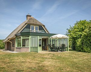 Villa with Conservatory in De Koog, Texel with charming exterior and green surroundings.