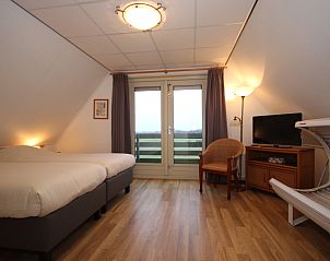 Second bedroom with balcony in Villa with Conservatory, Texel.