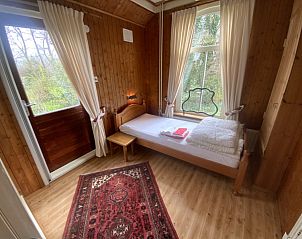 Bedroom with view of nature in Voorhuis vacation home De Koog Texel.