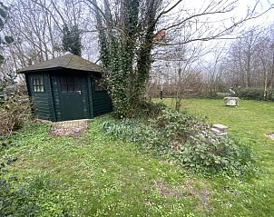 Large garden with garden house at Voorhuis vacation home in De Koog Texel.