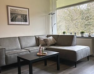 Comfortable sitting area in Apartment Kerckeland 40, De Koog, Texel with green surroundings.