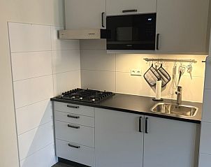 Compact kitchen facilities in Apartment Kerckeland 40, De Koog, Texel for convenience.