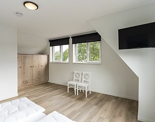 Spacious bedroom with view in Villa 37, De Koog, Texel. Vacation home on the Wadden Islands.