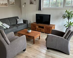 Exterior of vacation home Cottage in De Koog, Texel, with charming bricks and modern windows.