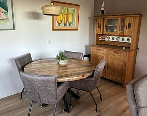 Stylish living room of Cottage in De Koog, Texel, with comfortable seating area and flat-screen TV.