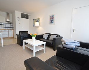 Cozy living room in Apartment Kerckeland 98, De Koog, Texel with comfortable seating and modern furnishings.