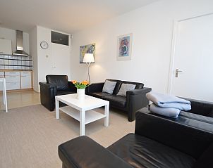 Open living room of Apartment Kerckeland 98, De Koog, Texel with stylish furnishings and lots of natural light.