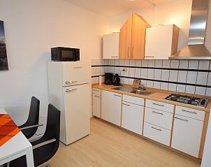 Compact kitchen of Apartment Kerckeland 98, De Koog, Texel with all the necessities for a comfortable stay.