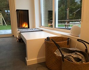 Gemtliche Sitzecke mit Kamin im Ferienhaus Buitenduin, De Koog, Texel.