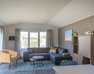 Spacious living room of Chalet Bregkoog 262 in De Koog, Texel, offers comfort and style on the Wadden Islands.