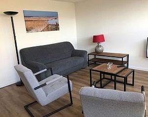 Stylish sitting area in 't Buitenhuisje, vacation home De Koog Texel, ideal for relaxation on the Wadden Islands.