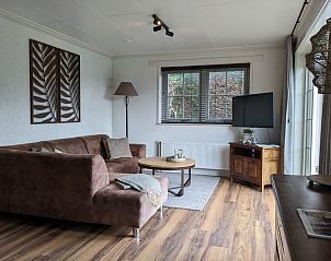 Cozy living room in D' Duinster vacation home, De Koog, Texel with comfortable seating area on the Wadden Islands.