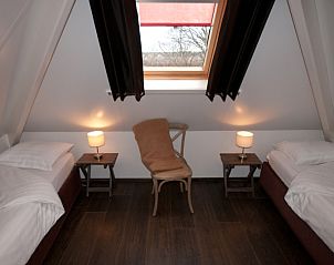Cozy attic room in D' Duinster vacation home, De Koog, Texel with two single beds on the Wadden Islands.