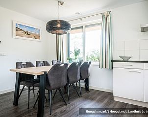 Dining area with view in Bungalowpark 't Hoogelandt vacation home, De Koog, Texel.