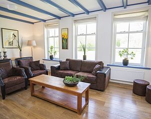 Gezellige woonkamer met houtkachel in Stolp Nieuw Bornrif - Familiehuis, De Koog, Texel.