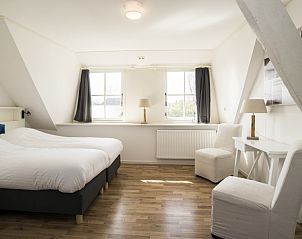 Slaapkamer met comfortabele bedden in Stolp Nieuw Bornrif - Familiehuis, vakantiewoning in De Koog, Texel.
