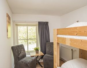 Terras met comfortabele zitjes in Stolp Nieuw Bornrif - Familiehuis, De Koog, Texel.