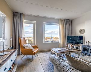 Gemtliche Sitzecke im Apartment Juliana 116 Zeezicht, De Koog, Texel mit Panoramablick ber das Wattenmeer.